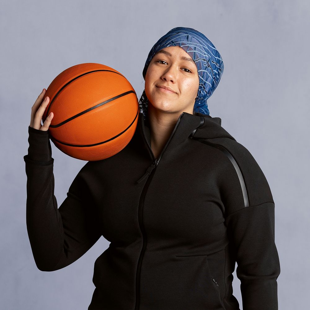 Islamic woman holding a basketball mockup 