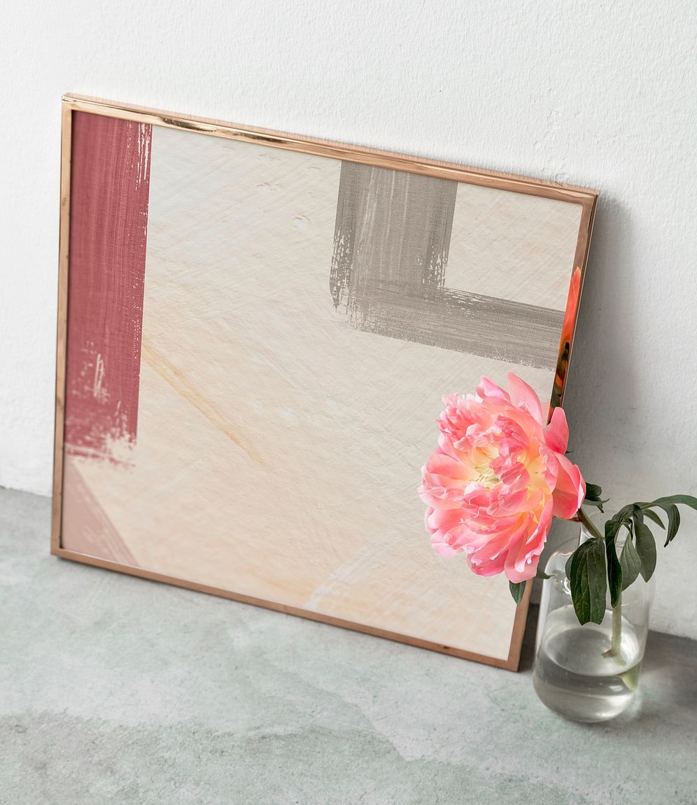 Blank golden frame mockup by a coral sunset peony