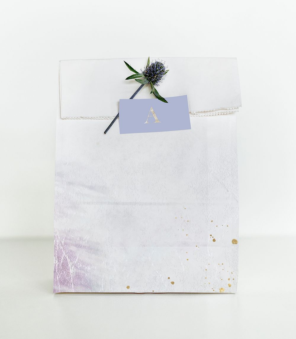 Grunge white paper bag with alpine sea holly