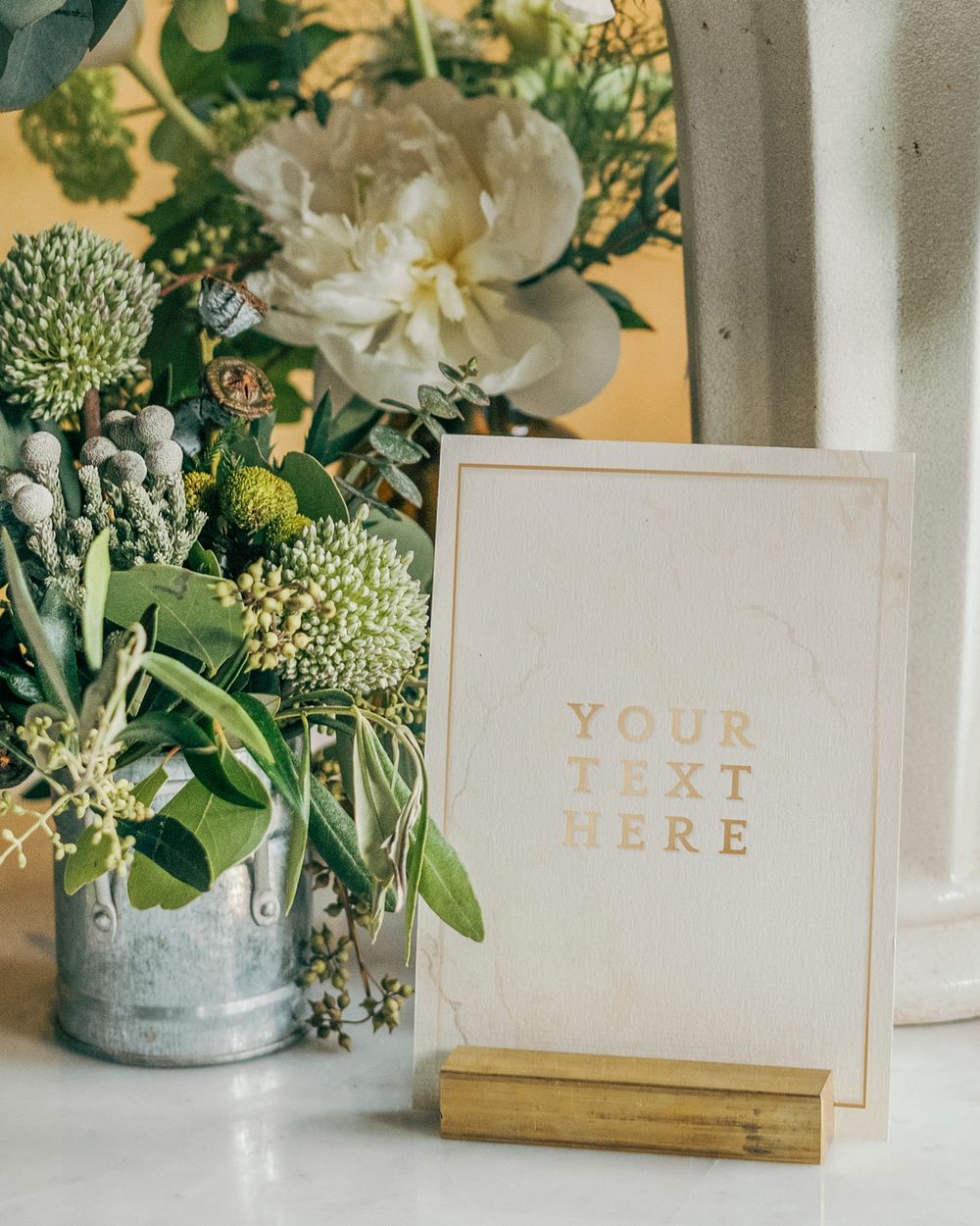 Bucket of fresh flowers with a card mockup