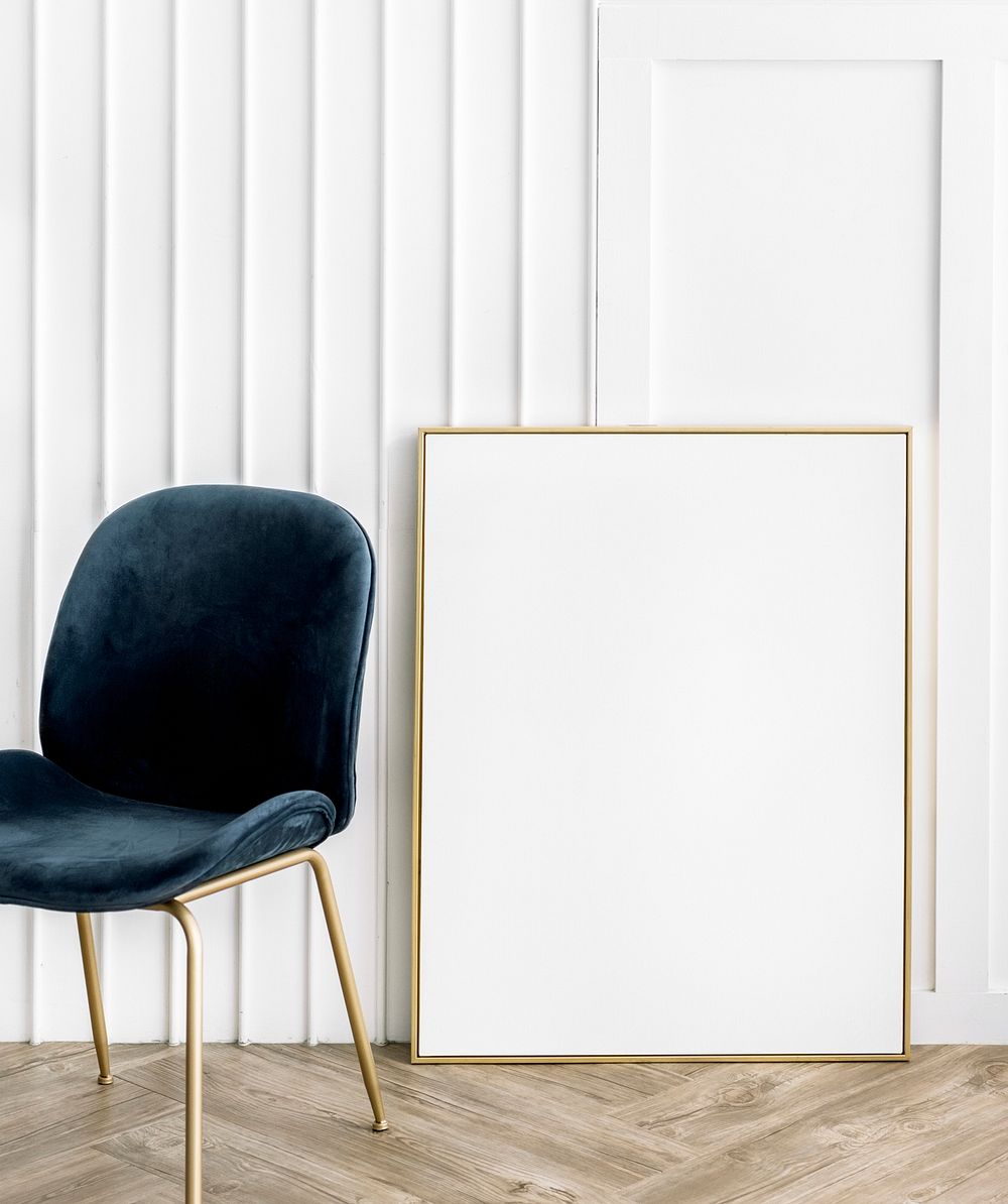 Golden frame mockup against a wall