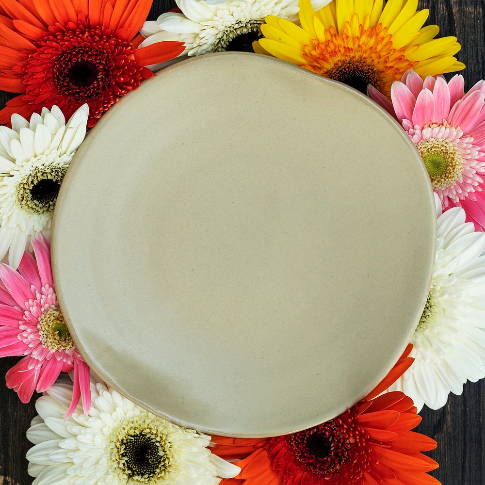 Gerbera flowers surrounding a plate