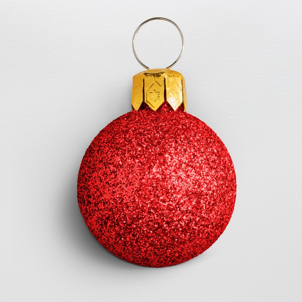 A glitter red ball Christmas ornament isolated on gray background