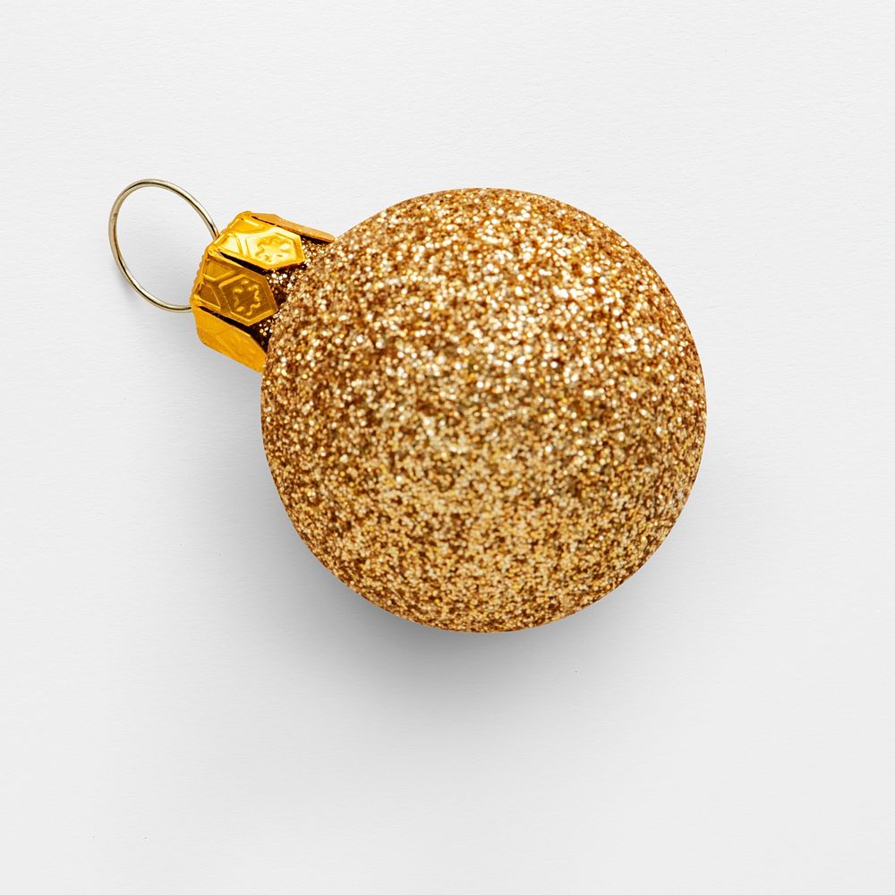 A glitter gold ball Christmas ornament isolated on gray background