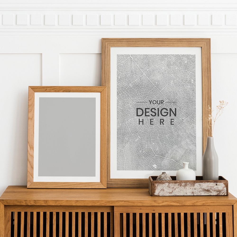 Picture frame mockups on a wooden sideboard table 