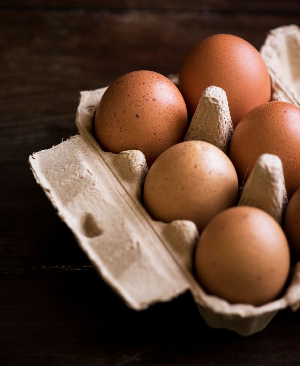 Closeup of fresh organic eggs in a paper box