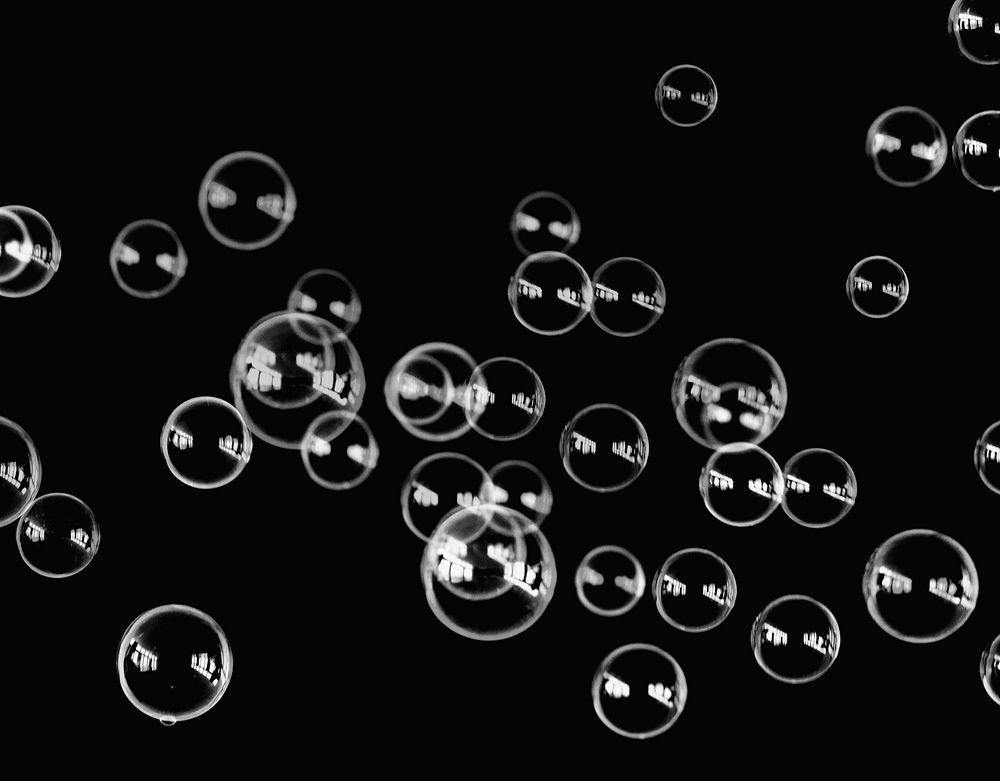 A bunch of bubbles on a black background