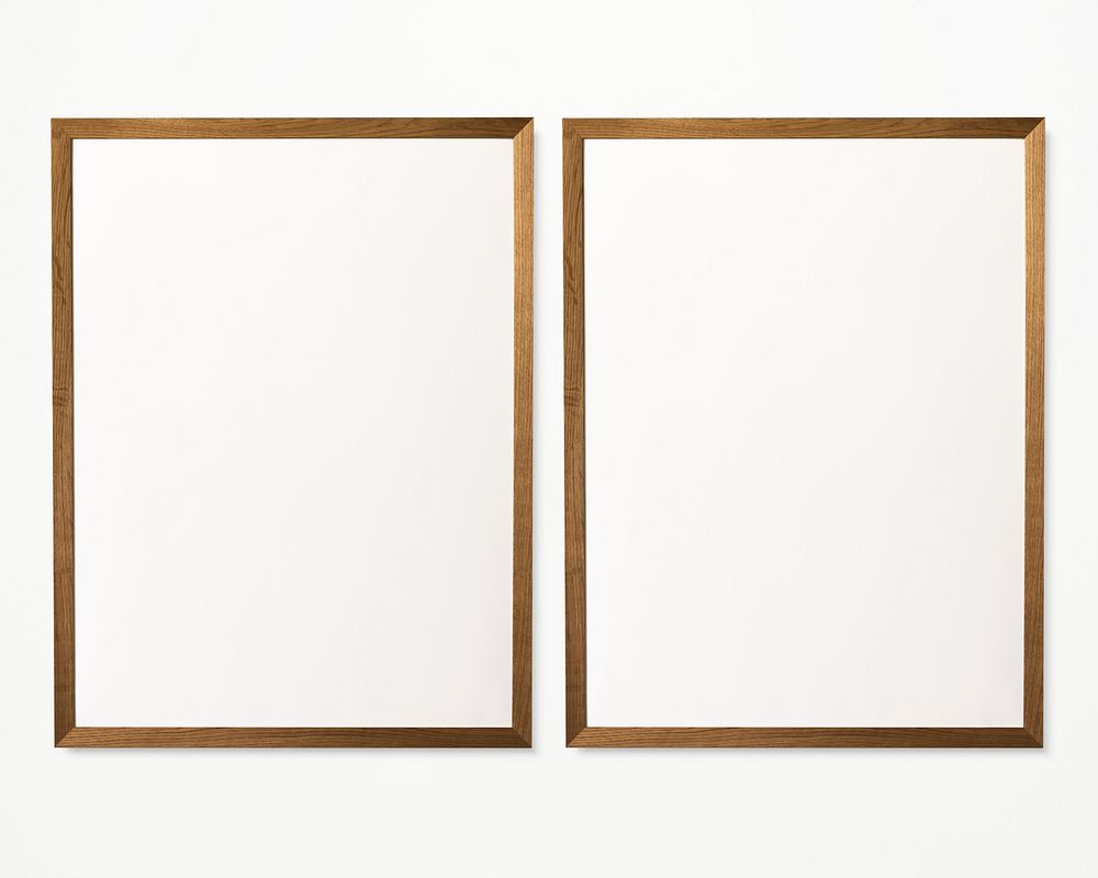 Two photo frames isolated on white wall