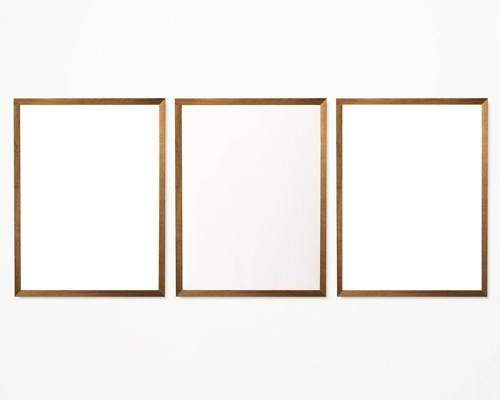 Three photo frames isolated on a white wall