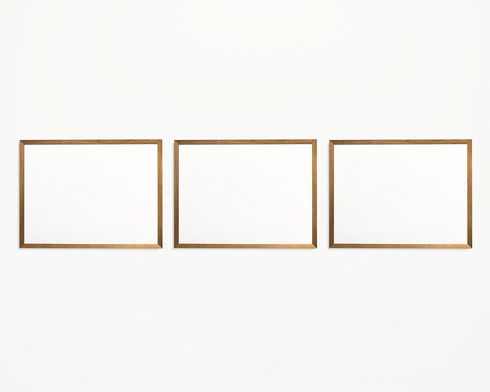 Three photo frames isolated on white wall