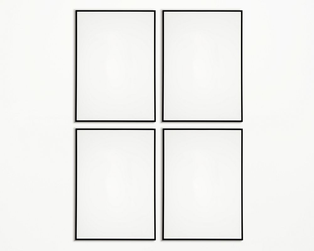 Four photo frames isolated on white wall