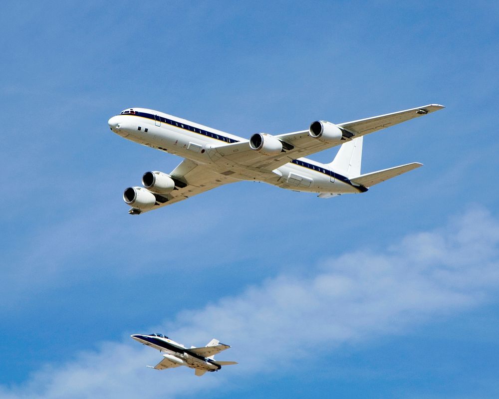 NASA's DC-8 airborne science laboratory is shadowed by a NASA F/A-18 chase plane during a flyover of the Dryden Aircraft…