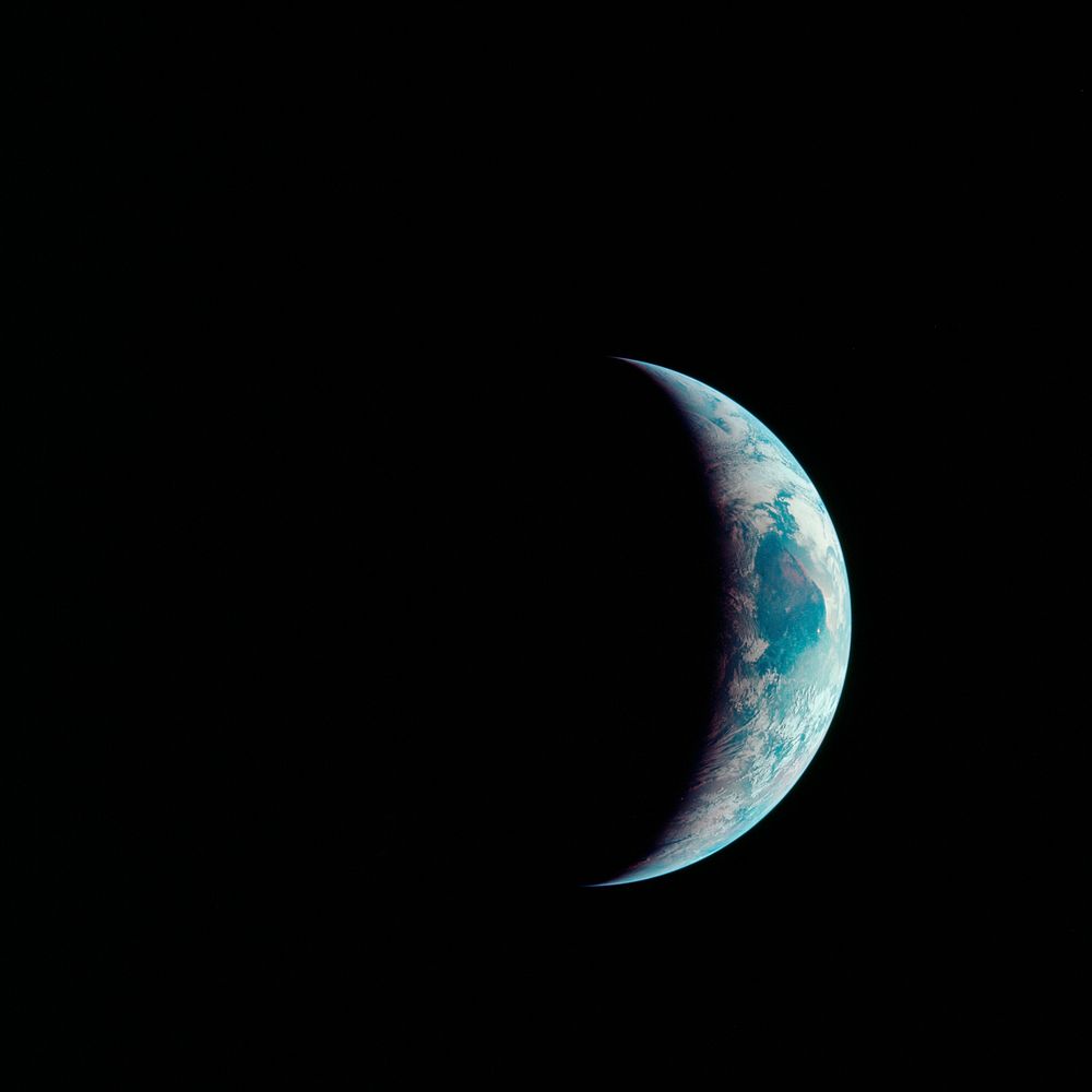 One-third of the Earth's sphere illuminated, Earth's terminator, sunglint, a portion of east Africa, as photographed from…