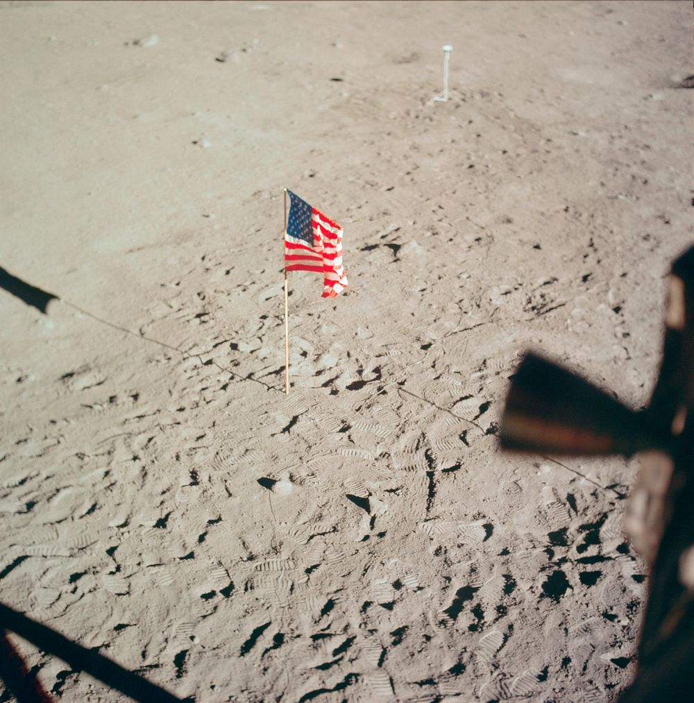 The flag of the United States and the footprints of astronauts Neil A. Armstrong and Edwin E. Aldrin Jr., deployed on the…