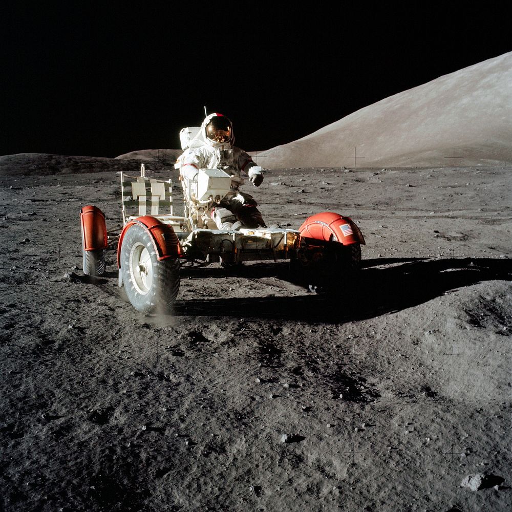 Astronaut Eugene A. Cernan, commander, drives the Lunar Roving Vehicle during first Apollo 17 extravehicular activity at the…