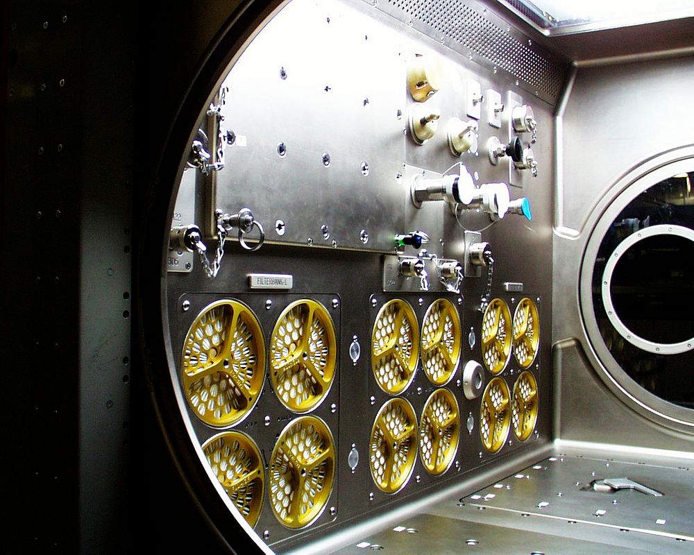 Interior lights give the Microgravity Science Glovebox (MSG) the appearance of a high-tech juke box. Original from NASA.…
