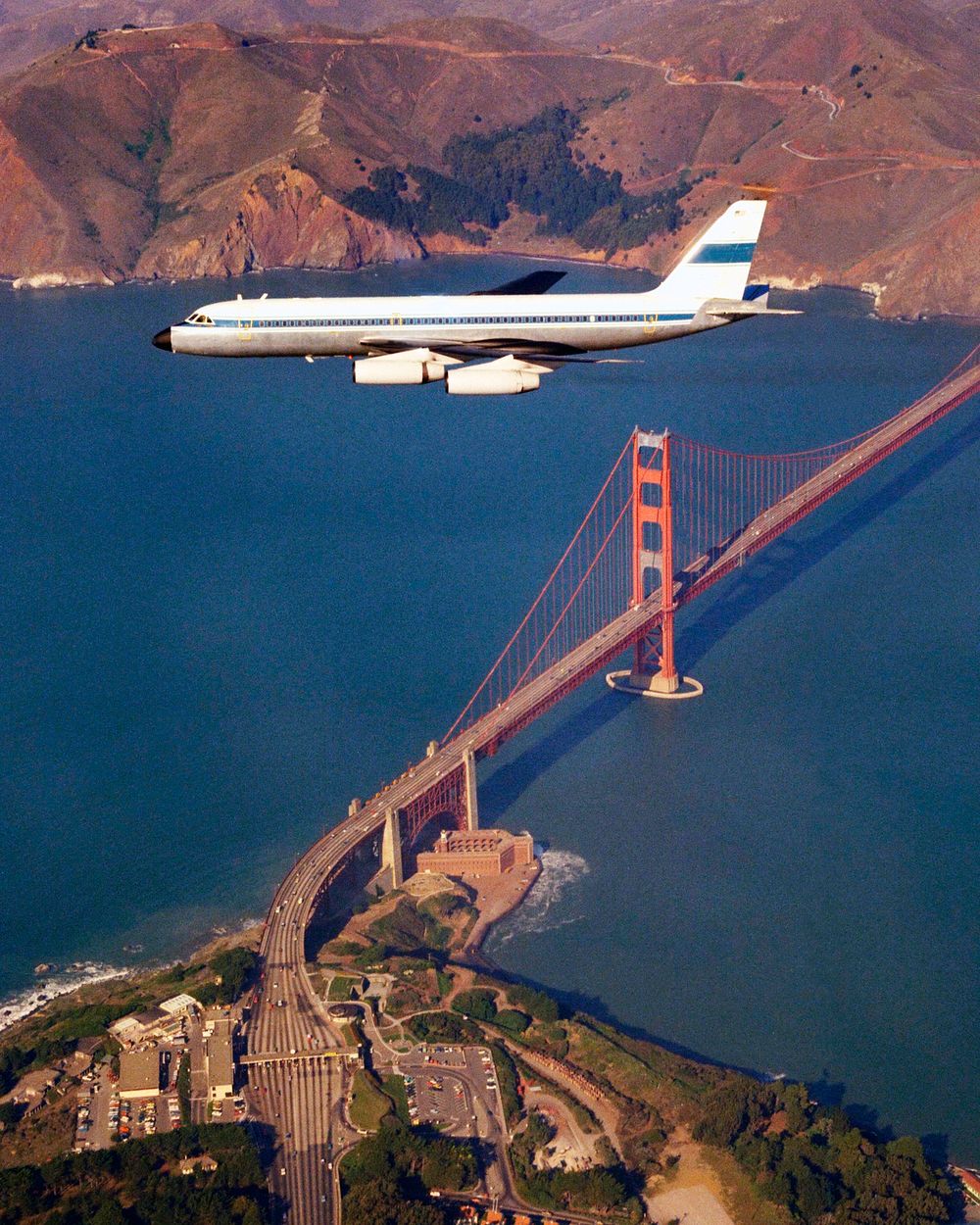 CV-990 (NASA-712) Galileo II aircraft in flight over the San Francisco's Golden Gate Bridge. Original from NASA. Digitally…