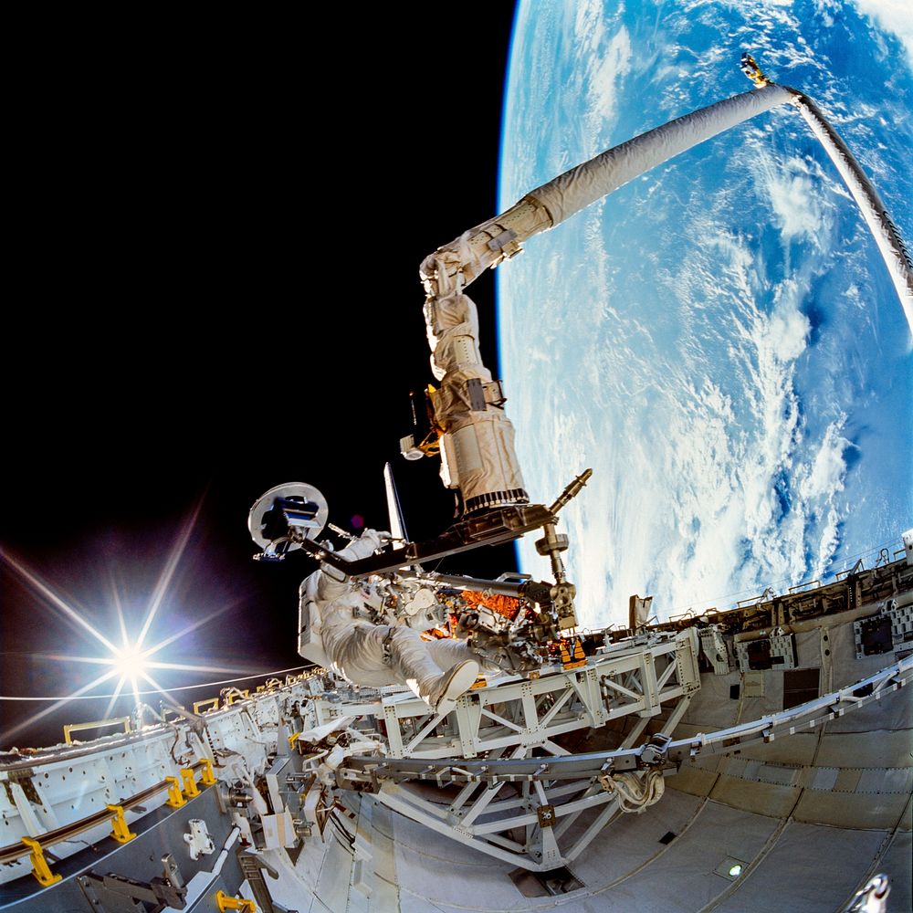 Payload bay activity during first EVA of STS-72 mission. Jan 15th, 1996. Original from NASA. Digitally enhanced by rawpixel.