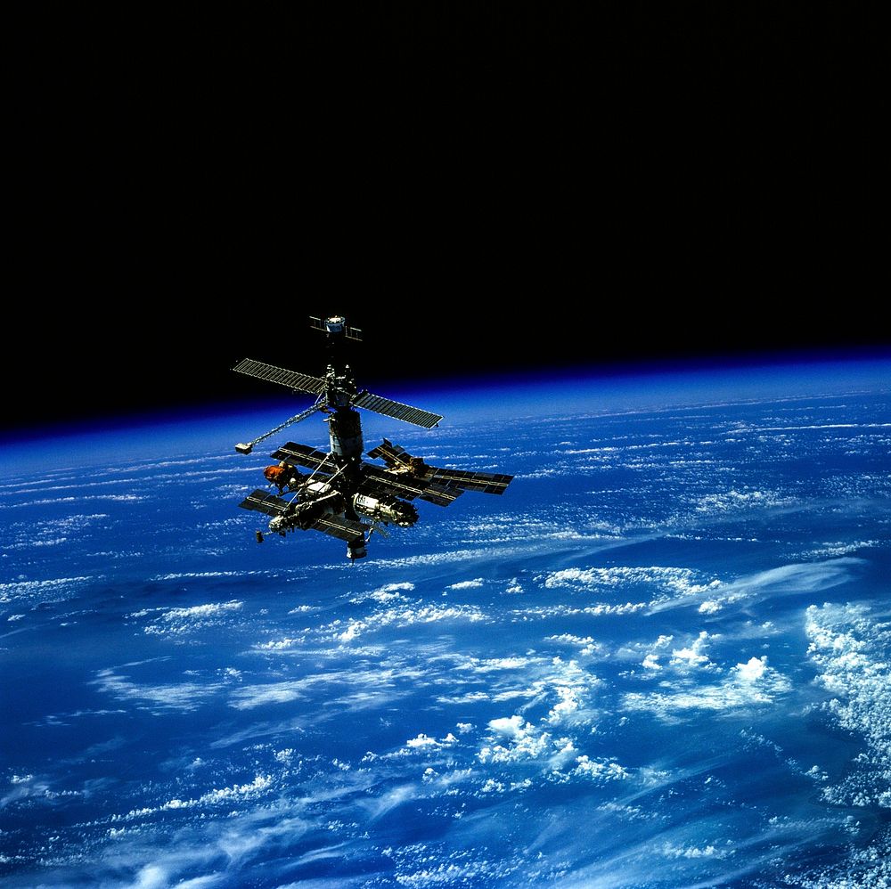Russia's Mir Space Station, backdropped over Earth's horizon. Original from NASA. Digitally enhanced by rawpixel.
