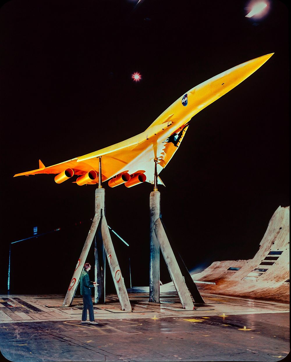 Supersonic Transport Model mounted in the Ames 40x80 Foot Wind Tunnel. SCAT-15F supersonic transport model, lower 3/4 front…