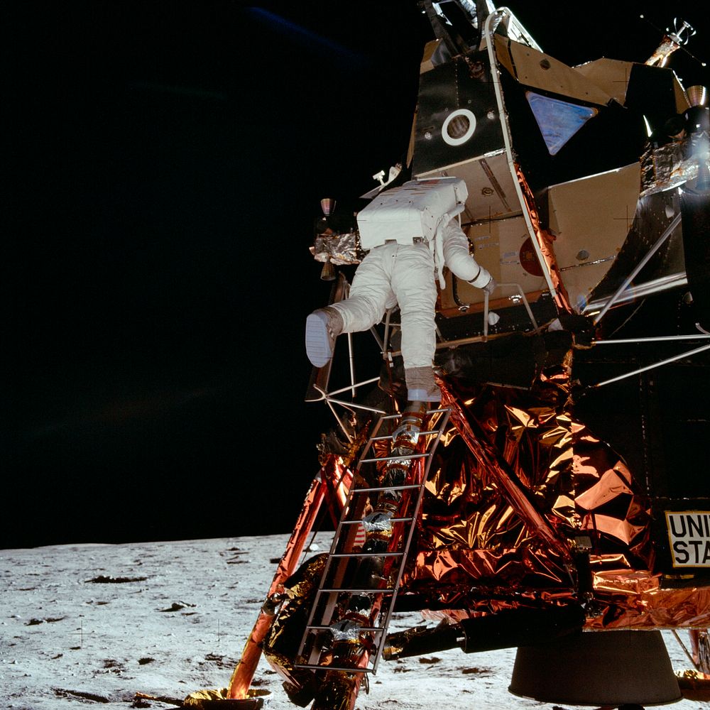 Astronaut Edwin E Aldrin Jr, Lunar Module (LM) pilot descends from the LM, climbing down the ladder. Original from NASA.…