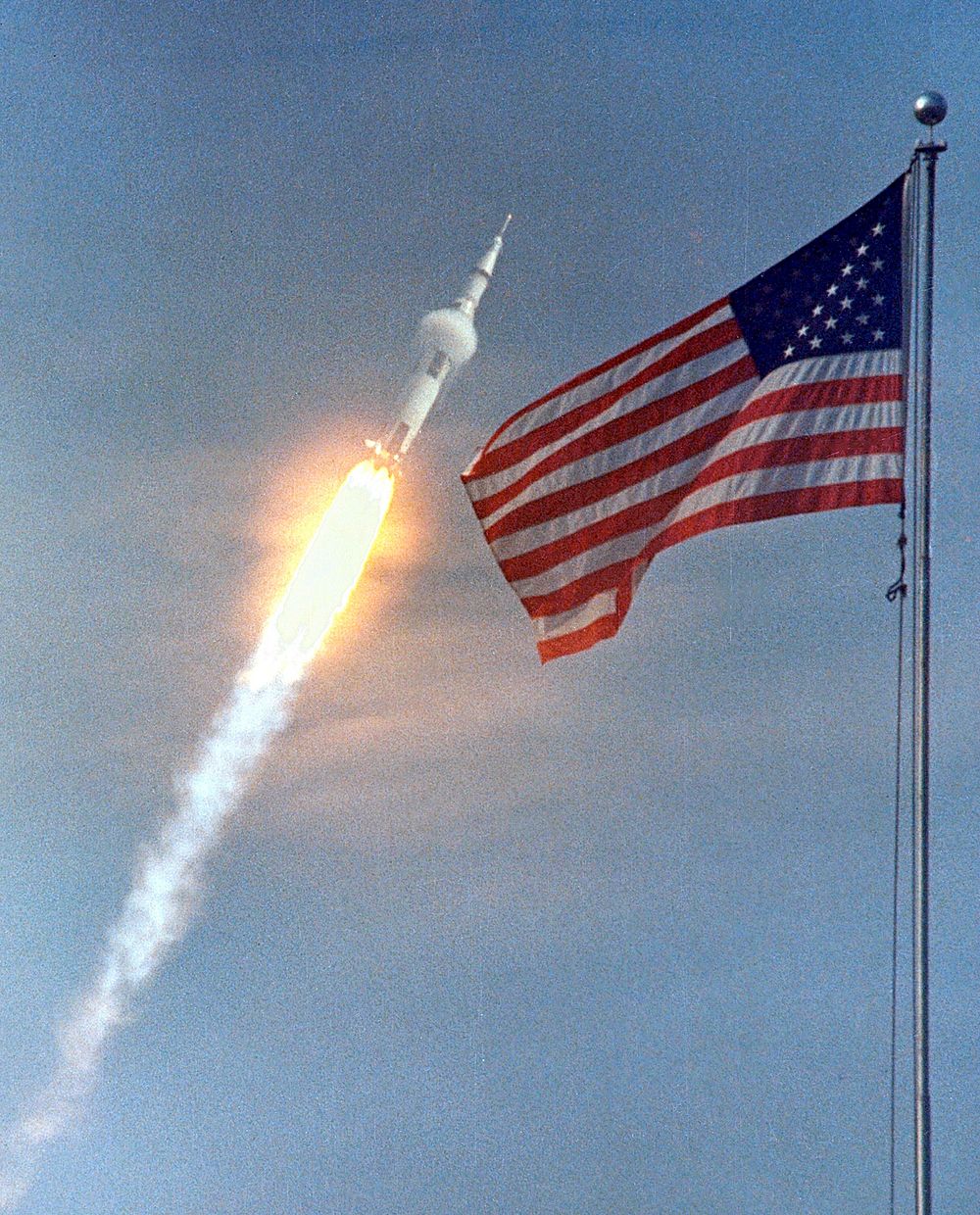 The American Flag heralds the flight of Apollo 11, man's first lunar landing mission. Original from NASA. Digitally enhanced…