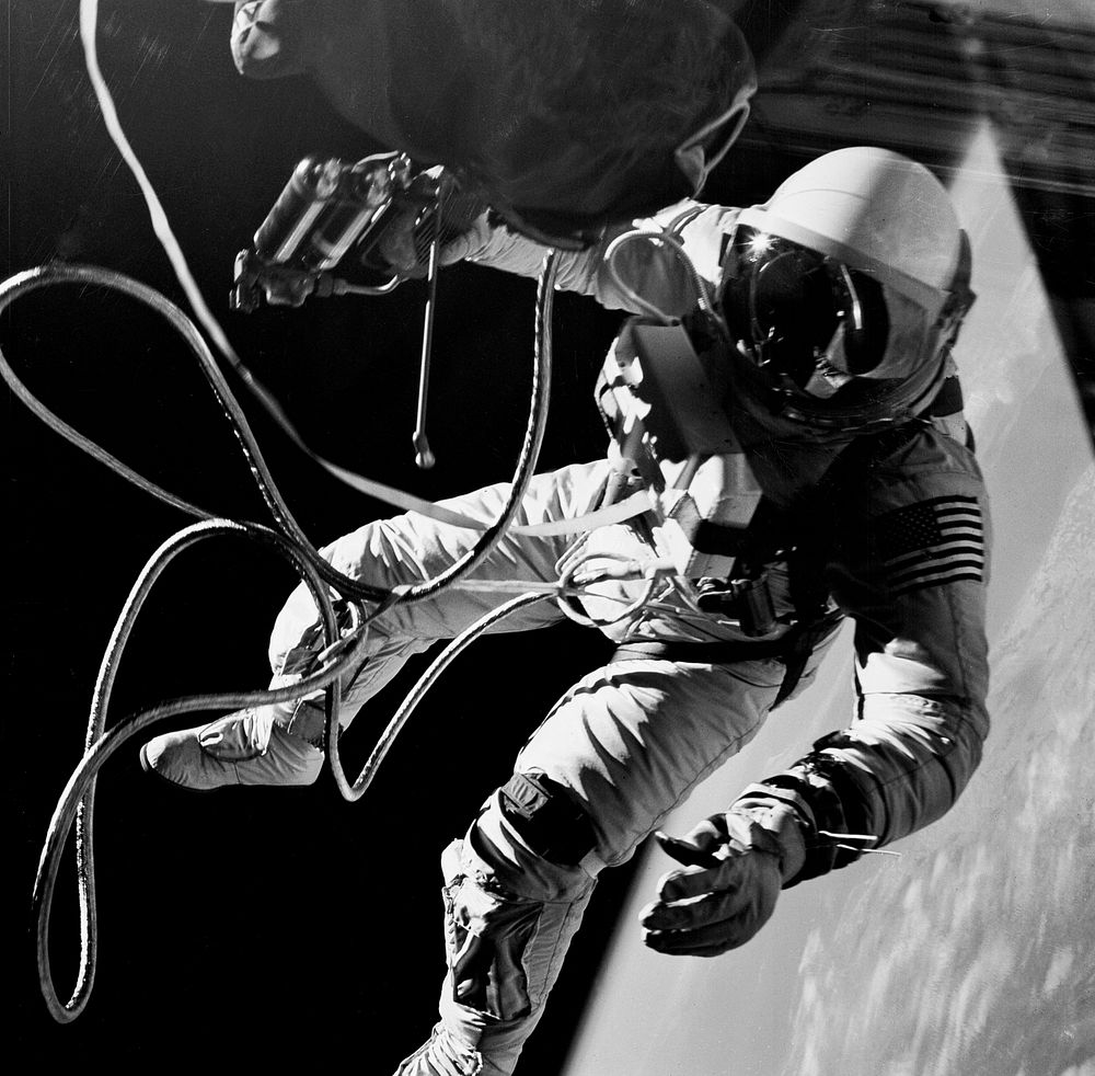 Astronaut Edward H. White II, pilot on the Gemini-Titan IV (GT-4) spaceflight, floats in the zero gravity of space outside…
