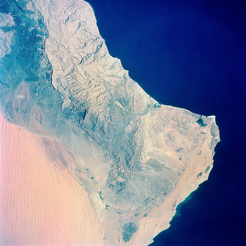 View of the southeastern tip of the Arabian Peninsula with the Gulf of Oman at upper right. Original from NASA . Digitally…