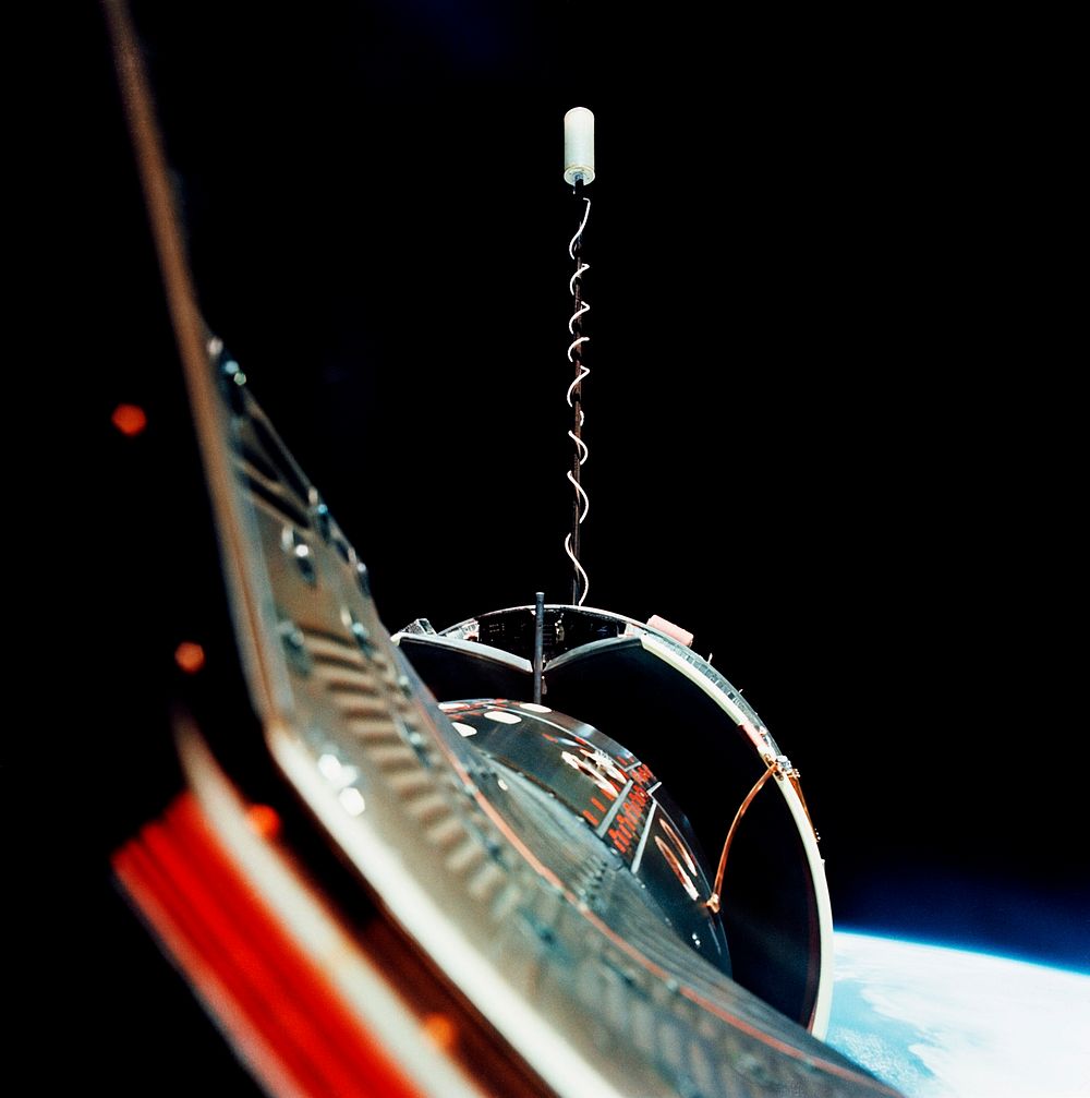The Gemini-10 spacecraft is successfully docked with the Agena Target Docking Vehicle 5005. Original from NASA. Digitally…