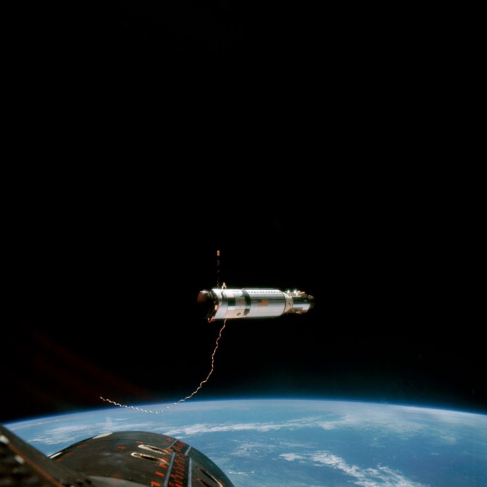 The Agena Target Docking Vehicle at a distance of approximately 80 feet from the Gemini-11 spacecraft. Original from NASA.…