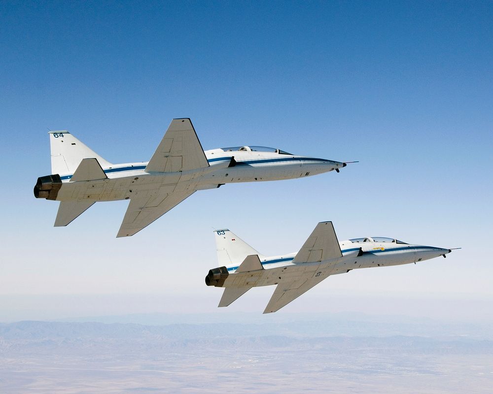 NASA Dryden's two T-38A mission support aircraft fly in tight formation, Sept 26th, 2007. Original from NASA. Digitally…