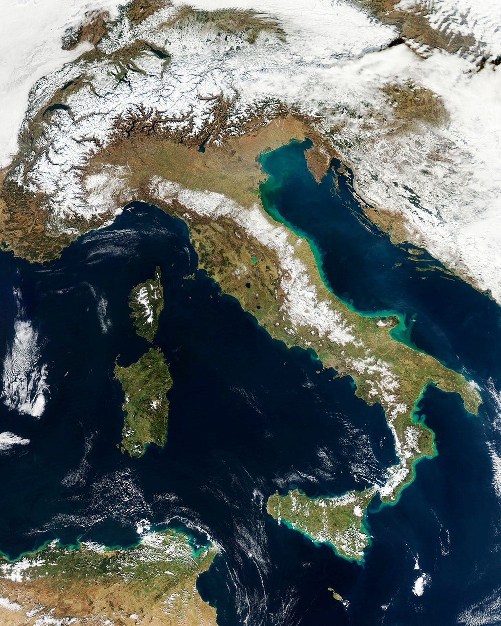 Snow, which tends to be generally less bright that clouds, covers the Alps in the north of Italy. Original from NASA.…