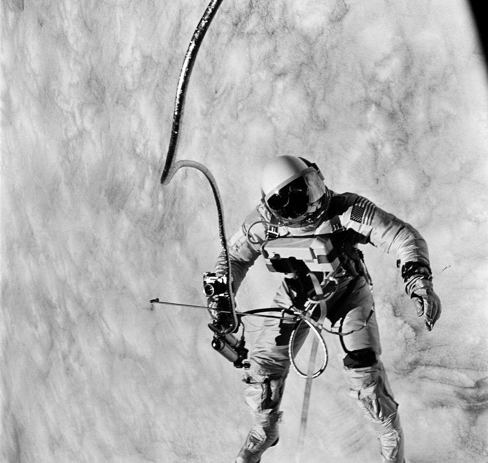 Astronaut Edward H. White II, pilot for the Gemini-Titan 4 (GT-4) spaceflight, floats in the zero-gravity of space during…