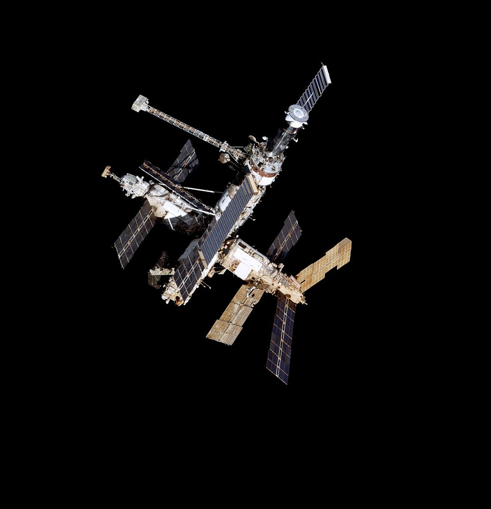 Full views of Mir Space Station after undocking during flyaround. Original from NASA. Digitally enhanced by rawpixel.