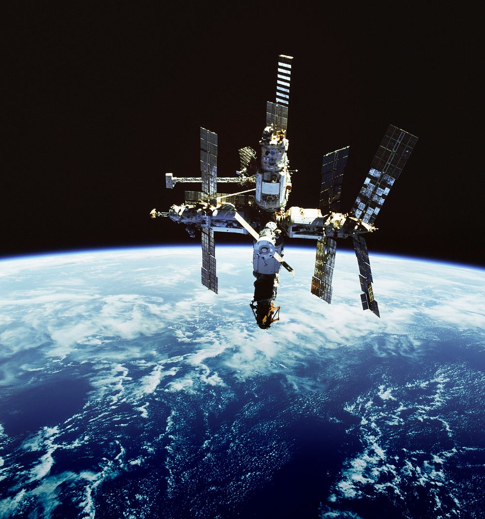 Russia's Mir space station is backdropped against Earth's horizon. Original from NASA . Digitally enhanced by rawpixel.