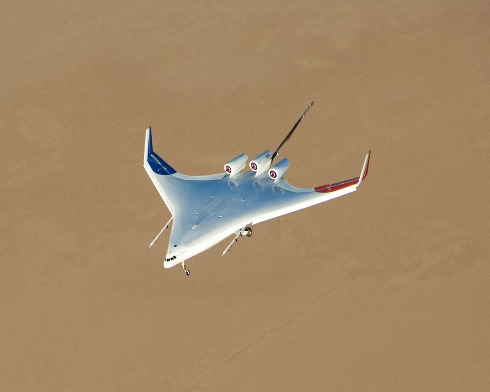 Boeing's X-48B Blended Wing Body technology demonstrator shows off its unique lines at sunset on Rogers Dry Lake adjacent to…