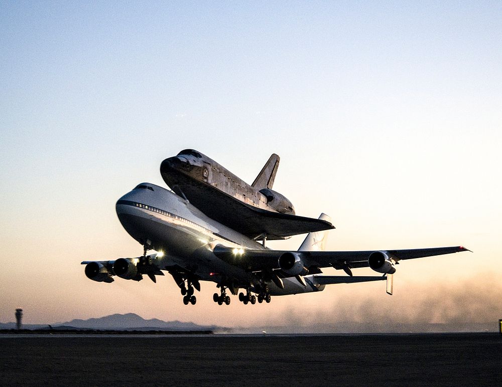EDWARDS AIR FORCE BASE, Calif. &ndash; ED09-0253-108) Space shuttle Discovery and its modified 747 carrier aircraft lift off…
