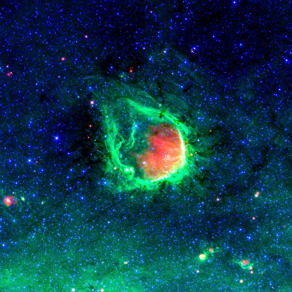 This glowing emerald nebula seen by NASA Spitzer Space Telescope is named RCW 120. Original from NASA. Digitally enhanced by…