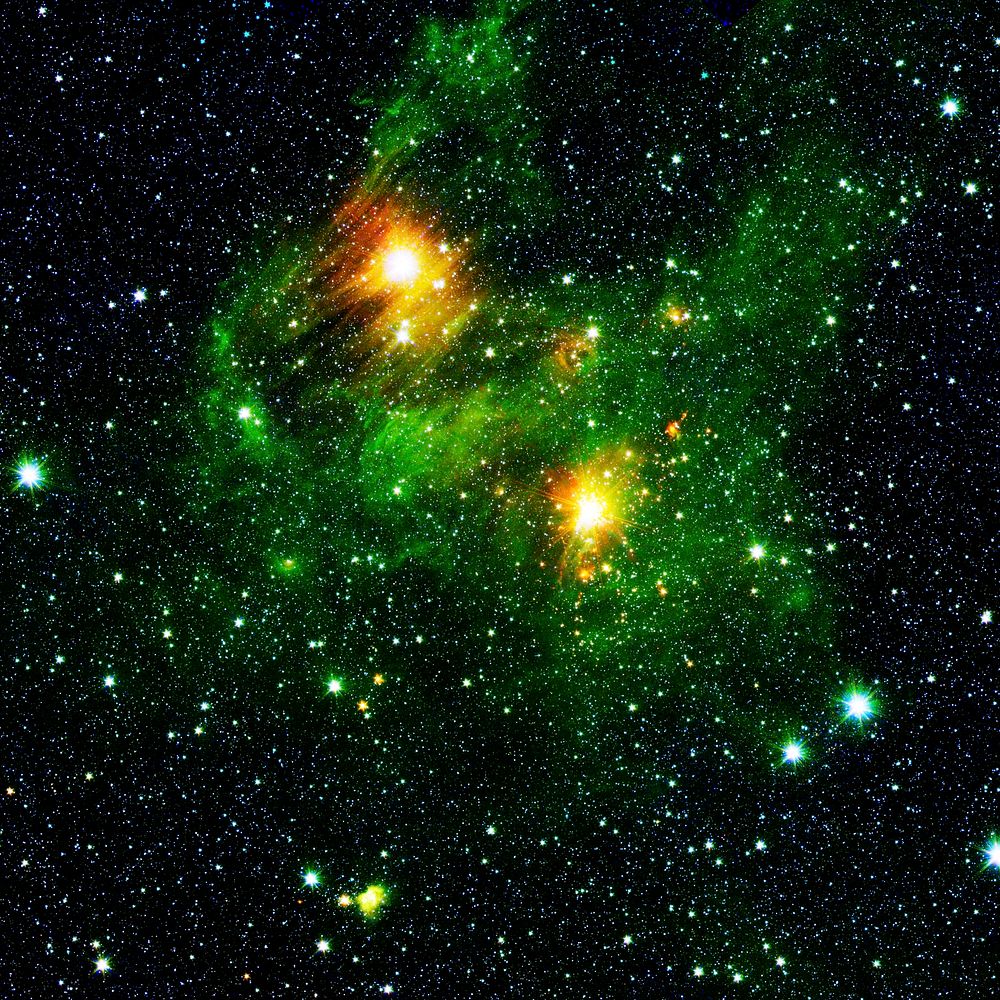 Two extremely bright stars illuminate a greenish mist in this image from the new GLIMPSE360 survey. Original from NASA.…