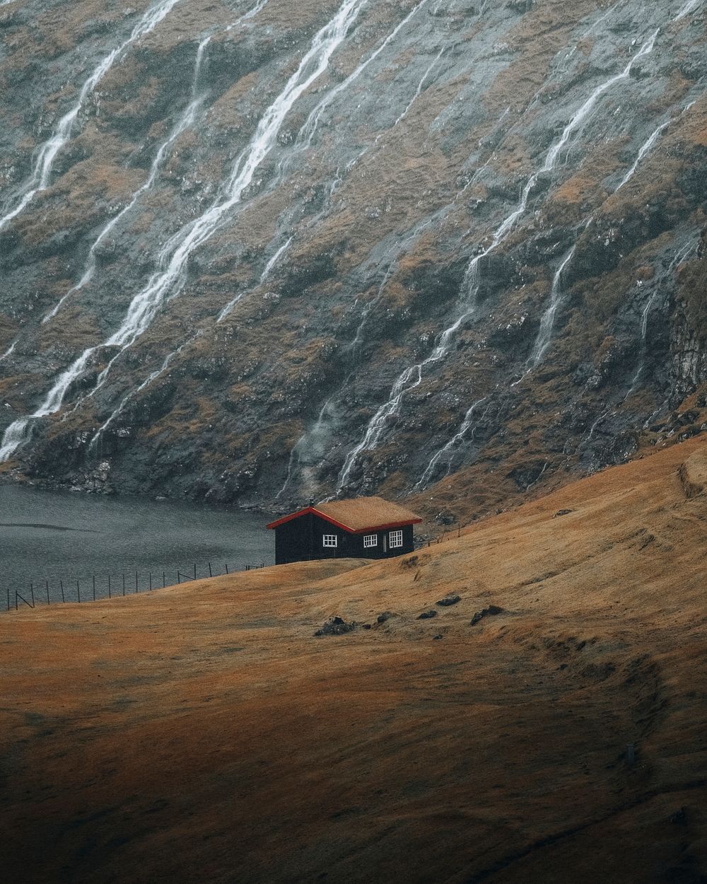 Cute cabin on the hill in Saksun village, Denmark