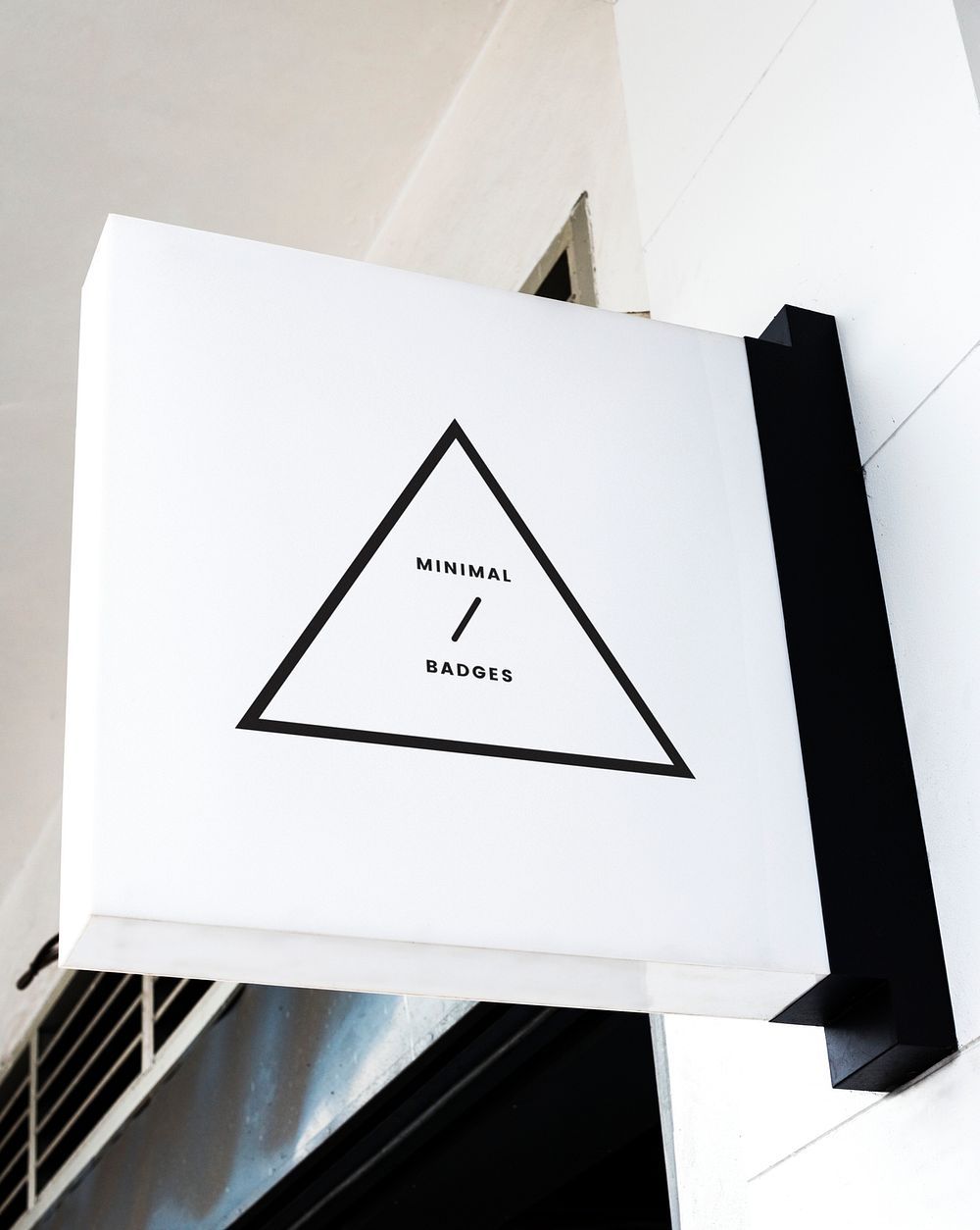 Minimal triangular badge on a white sign mockup