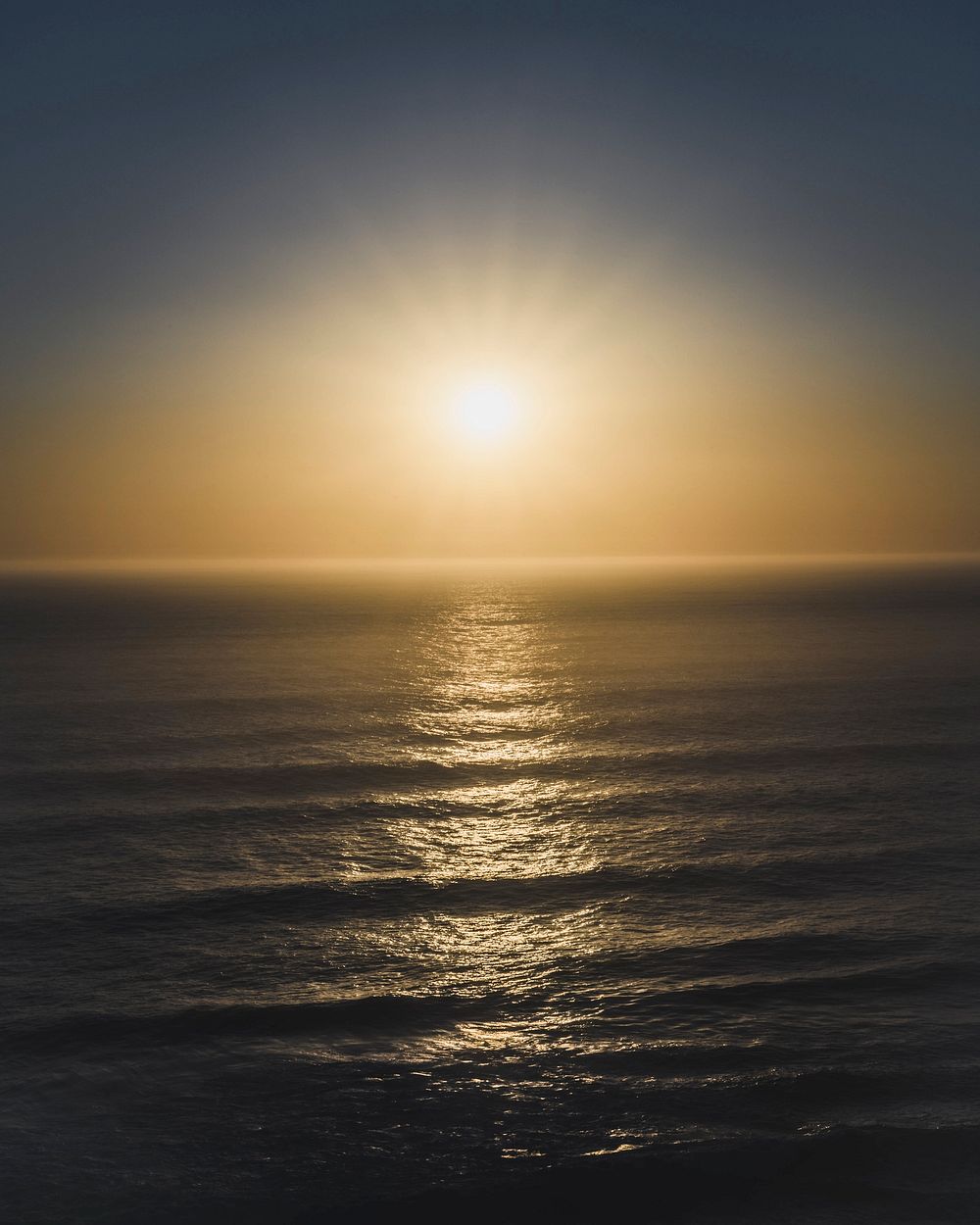 Sun setting over a sea