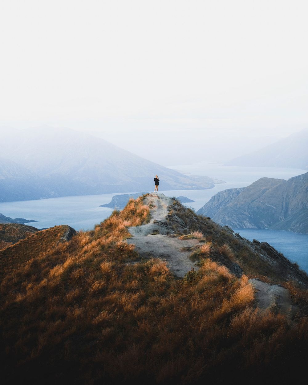 Woman standing at Roys Peak, New Zealand