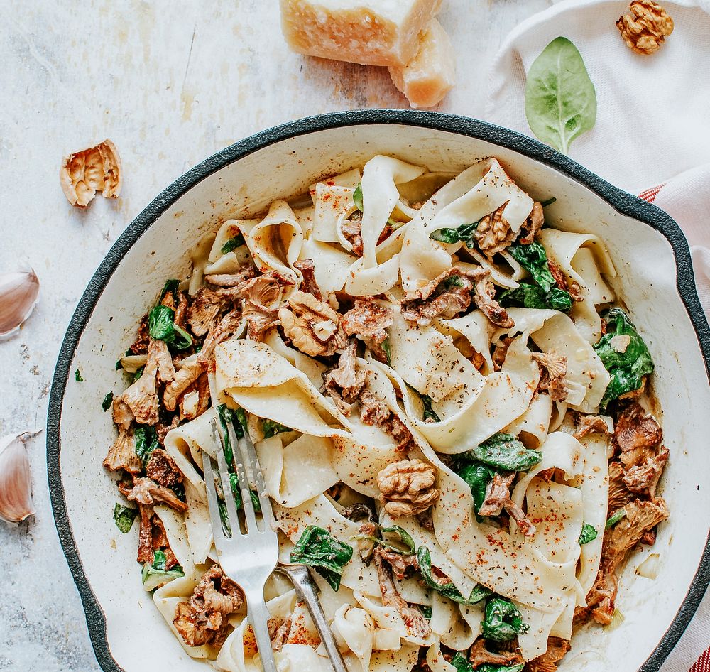 Homemade pappardelle pasta with mushrooms