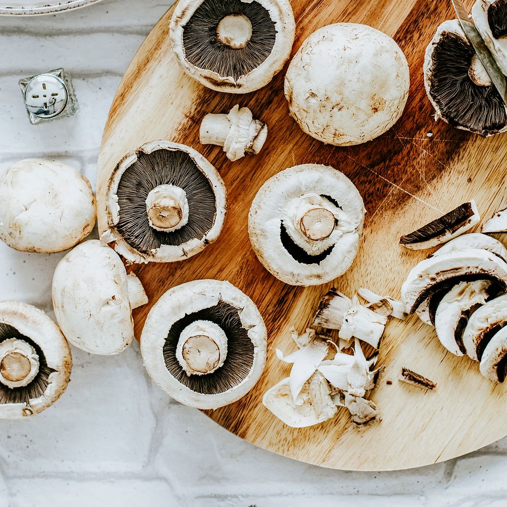 Prepared fresh mushrooms on a cutting board food photography