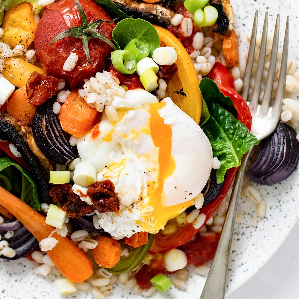 Barley with roasted vegetables and poached egg food photography