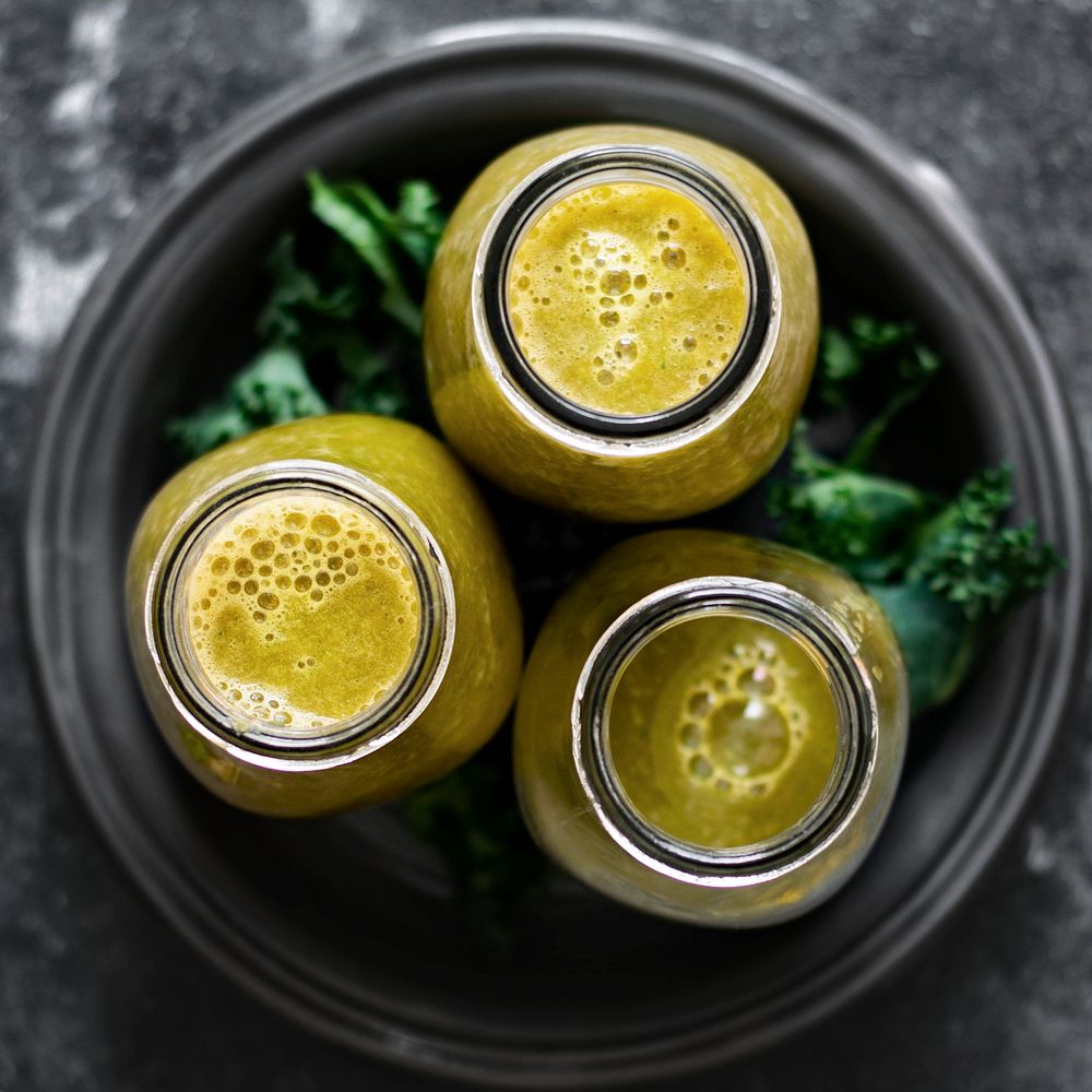Fresh ginger carrot and kale smoothie food photography