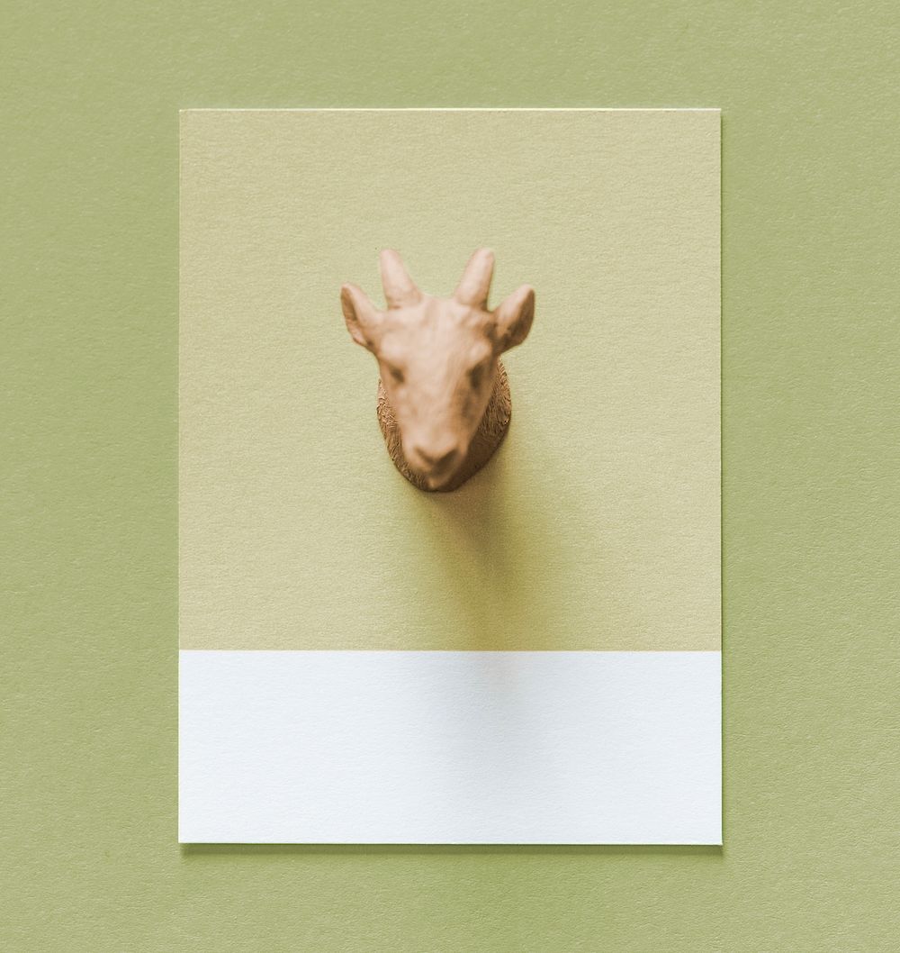 Colorful goat figure on a paper