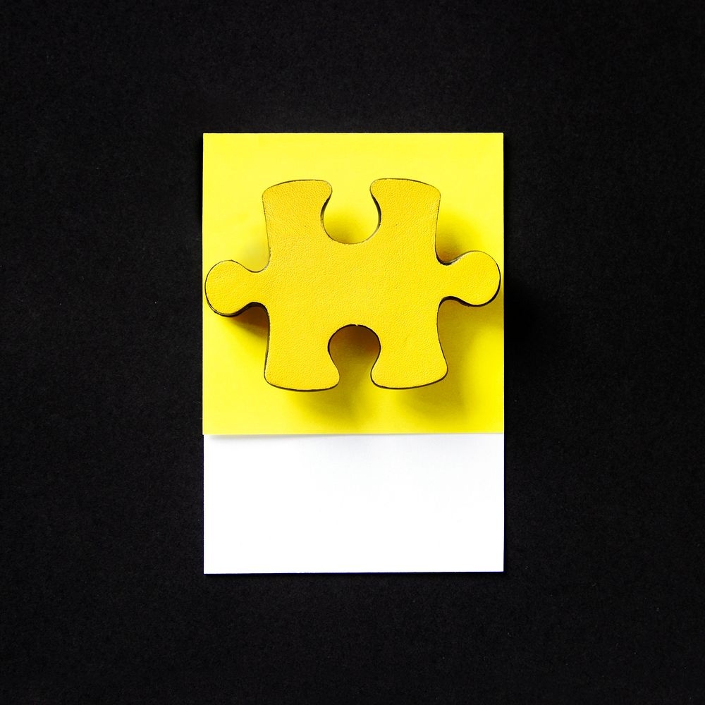 Yellow jigsaw game puzzle piece