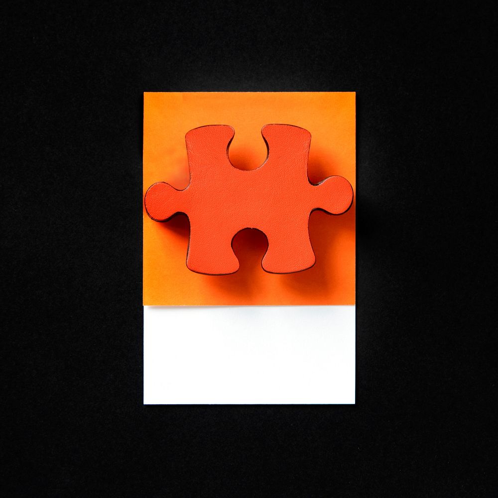 Orange jigsaw game puzzle piece